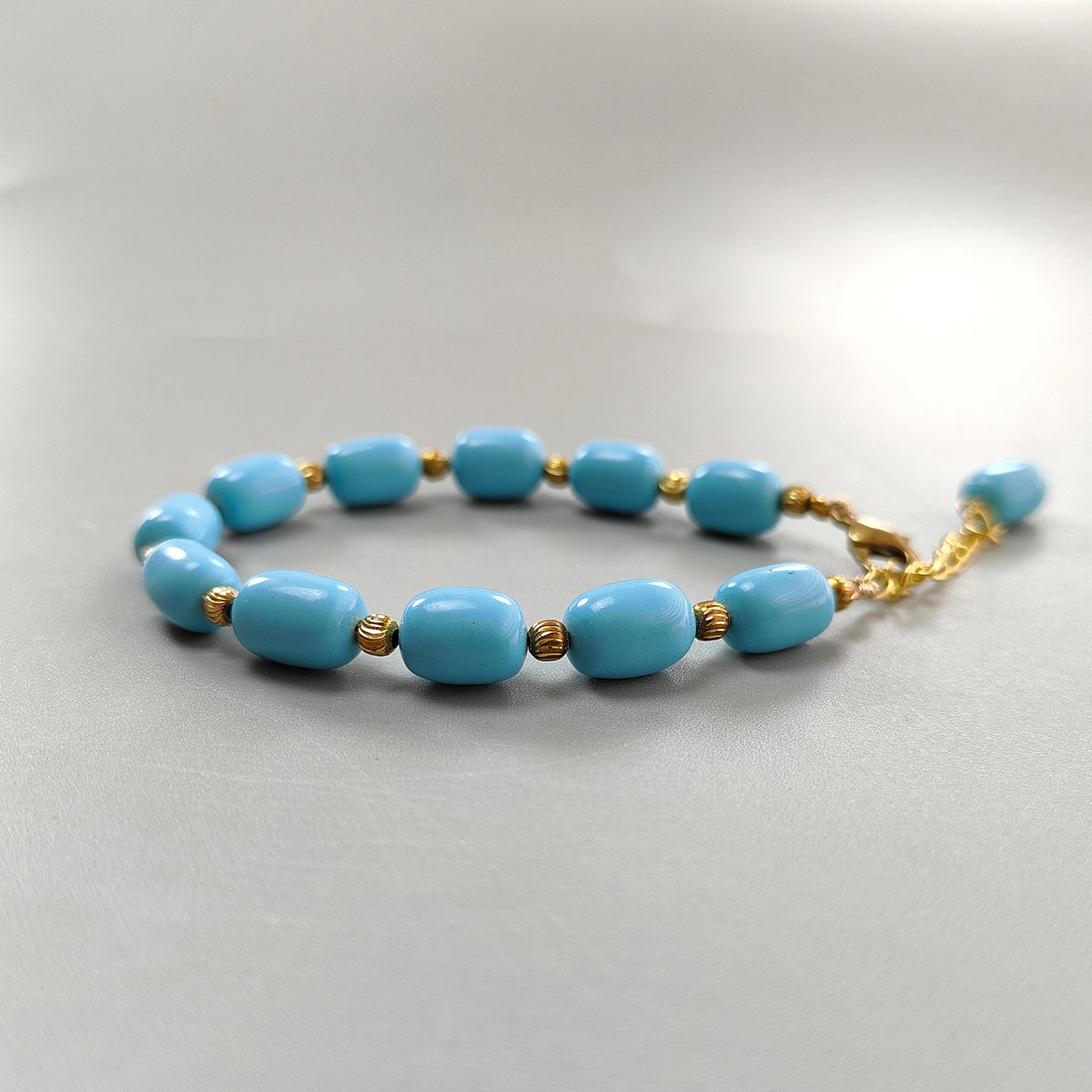 63.75cts Blue Synthetic Turquoise Plain Beads Baguette Brass Bracelet 10mm 7"