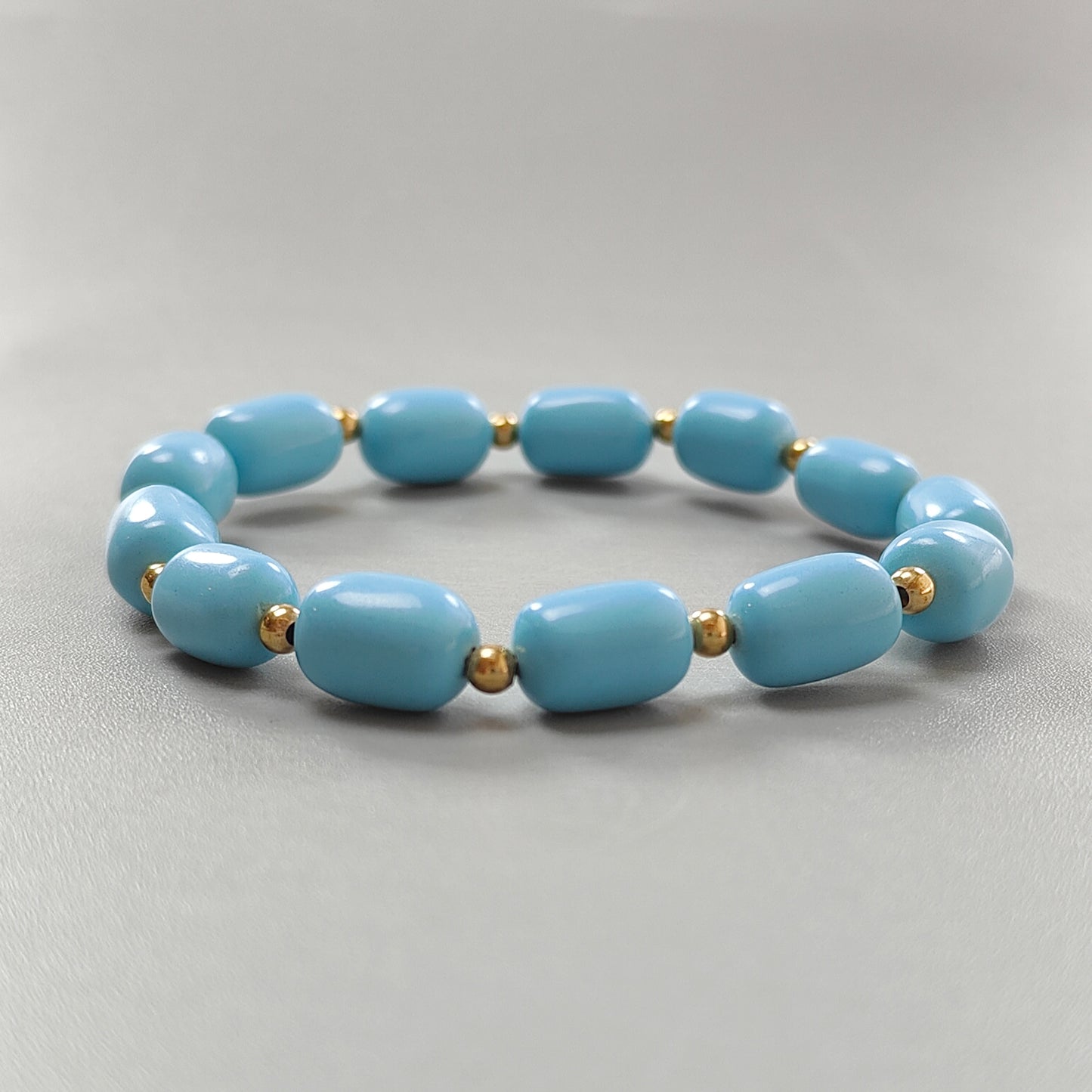 Blue Synthetic Turquoise Beads Bracelet: 53.70cts Simulant Turquoise Baguette Plain Stretchable Brass Bracelet 11mm 6"