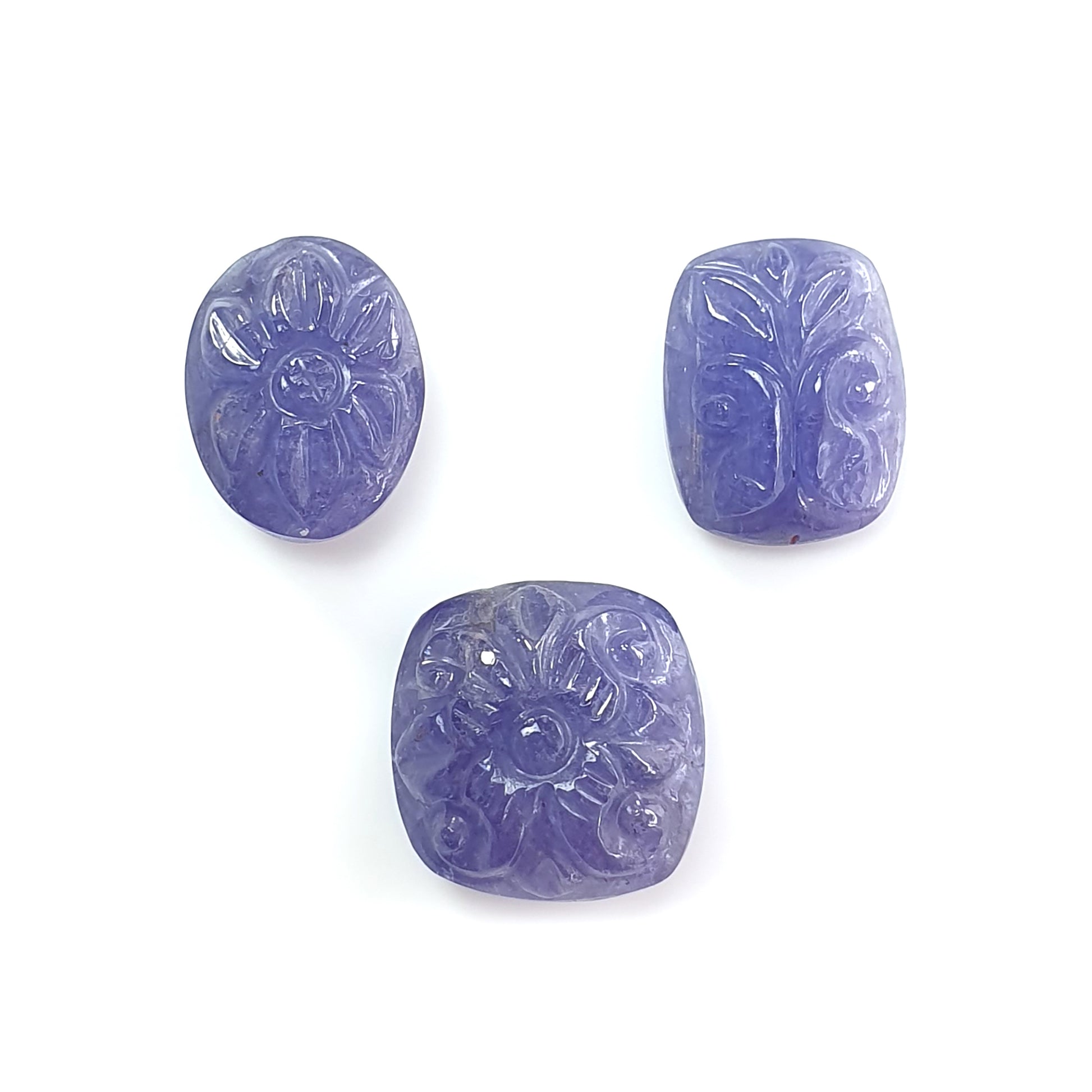 blue tnzanite cushion, oval shape carving