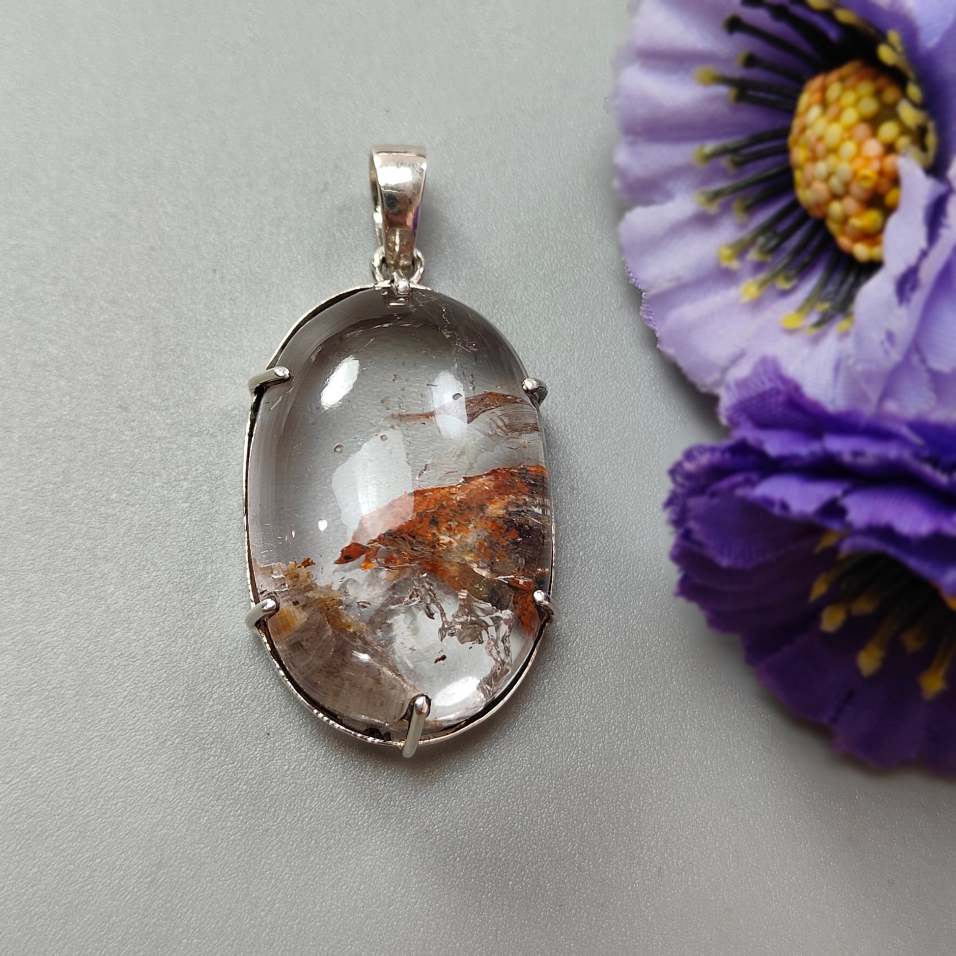 Silver pendant with a natural stone design
