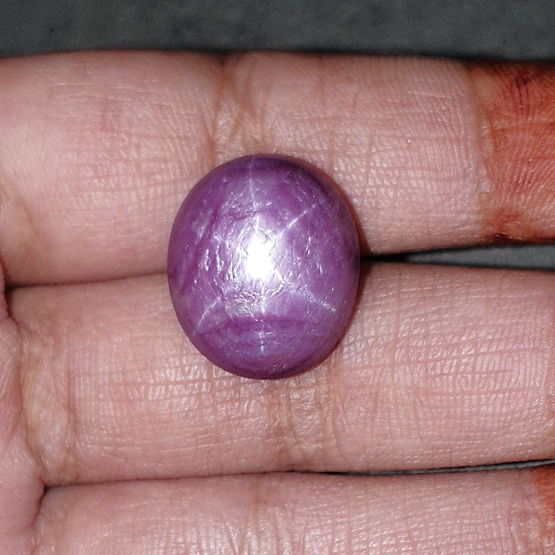 red star ruby oval cabochon